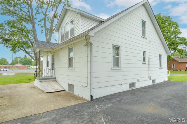 307 S S St, Smithton, IL 62285 - view of side of property with a shingled roof and a patio area