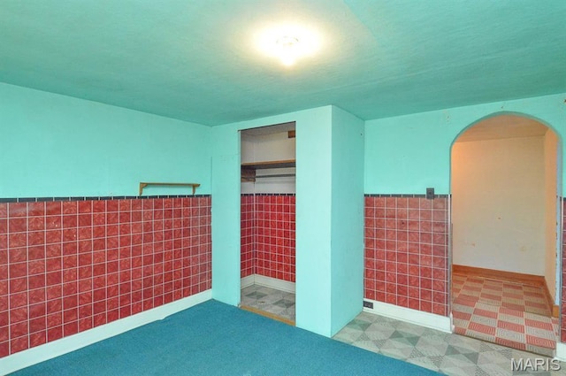 307 S S St, Smithton, IL 62285 - empty room with arched walkways and tile patterned floors
