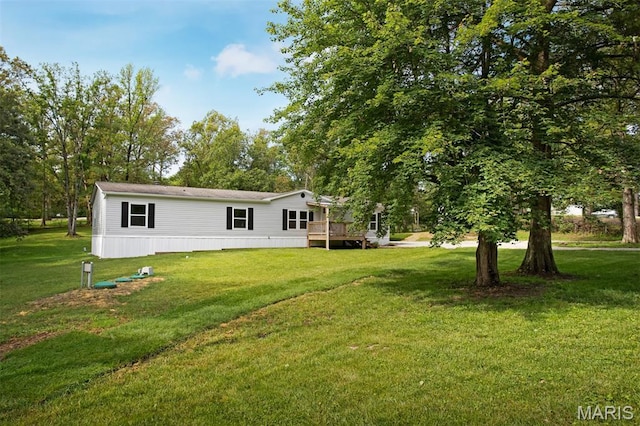 16 Garrett Ln, Defiance, MO 63341 - view of green lawn with a wooden deck