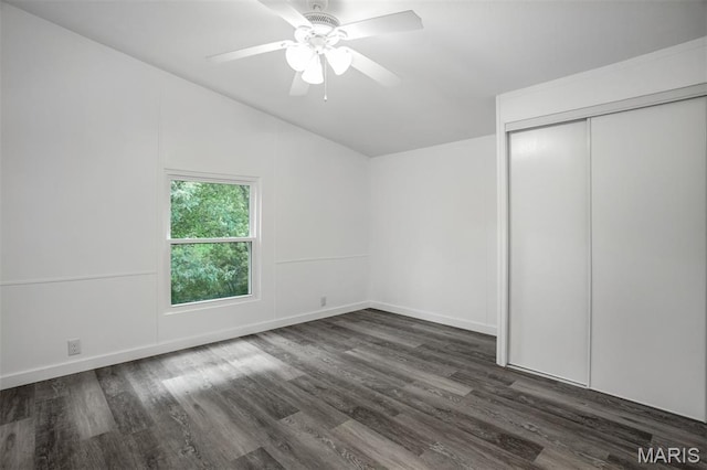 16 Garrett Ln, Defiance, MO 63341 - unfurnished bedroom with dark wood-style floors, a closet, vaulted ceiling, and a ceiling fan