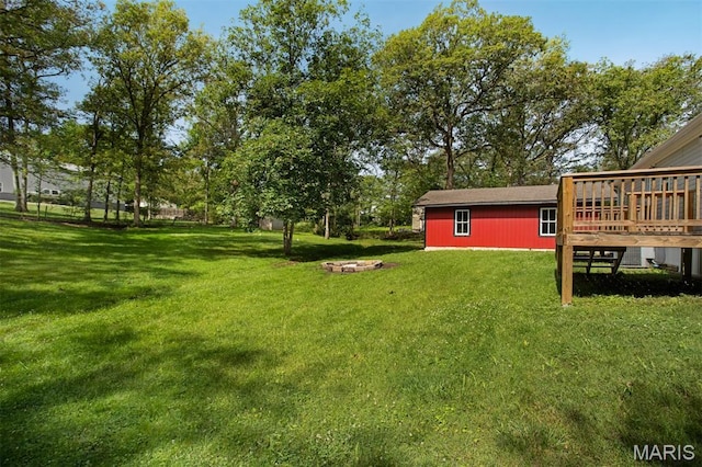 16 Garrett Ln, Defiance, MO 63341 - view of grassy yard with a wooden deck and an outbuilding