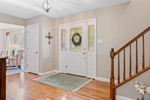 14 Greystoke Ct, Ballwin, MO 63021 - entryway with wood finished floors and stairway