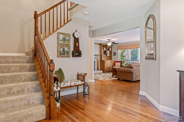 14 Greystoke Ct, Ballwin, MO 63021 - staircase with wood finished floors and a ceiling fan