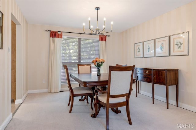 14 Greystoke Ct, Ballwin, MO 63021 - dining room featuring a chandelier and light colored carpet