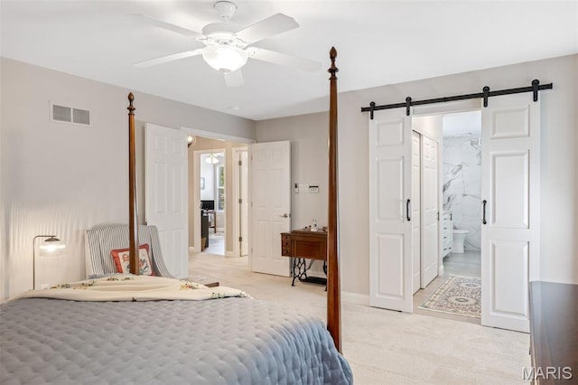 14 Greystoke Ct, Ballwin, MO 63021 - bedroom with a barn door, light carpet, connected bathroom, and a ceiling fan
