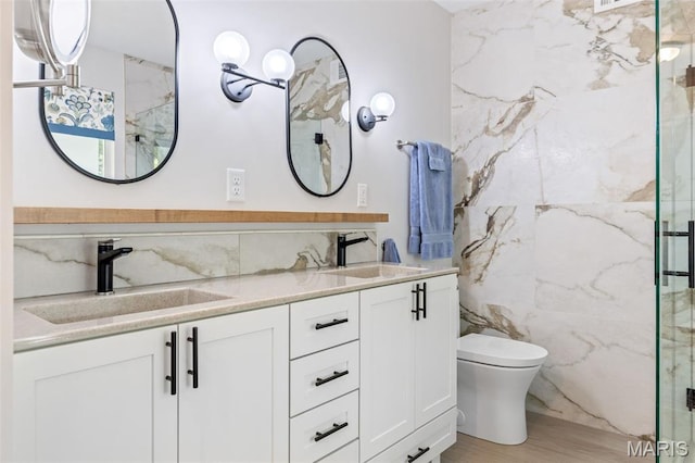 14 Greystoke Ct, Ballwin, MO 63021 - full bathroom featuring tile walls, a marble finish shower, double vanity, and wood finished floors