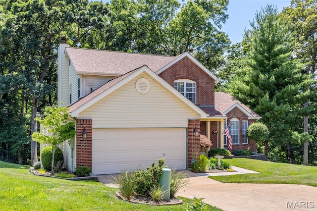14 Greystoke Ct, Ballwin, MO 63021 - traditional home featuring brick siding, driveway, a garage, and a front yard