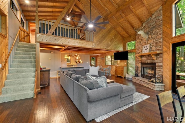 2506 Alpine Woods Dr, Wright City, MO 63390 - living room with wood walls, high vaulted ceiling, a wooden ceiling with exposed beams, a ceiling fan, and stairway