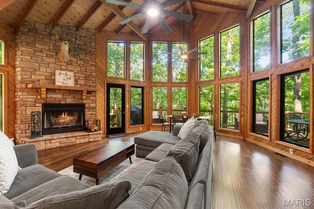 2506 Alpine Woods Dr, Wright City, MO 63390 - living room featuring high vaulted ceiling, ceiling fan, a wooden ceiling with exposed beams, wood-type flooring, and wooden walls