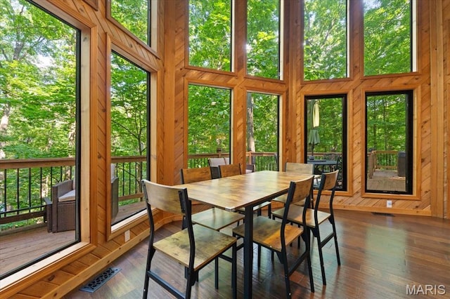 2506 Alpine Woods Dr, Wright City, MO 63390 - sunroom with a deck, wooden walls, and wood finished floors