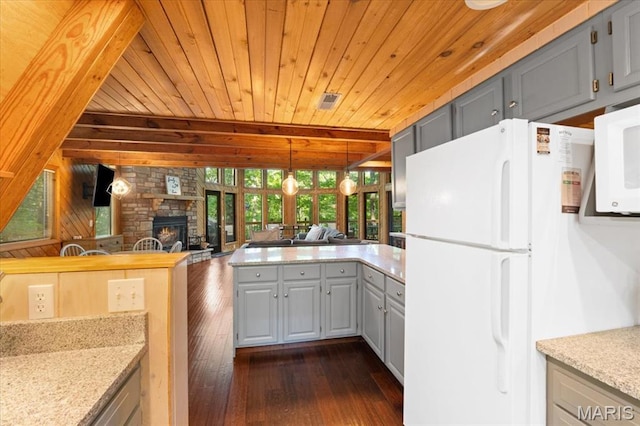2506 Alpine Woods Dr, Wright City, MO 63390 - kitchen featuring white appliances, gray cabinetry, dark wood finished floors, a stone fireplace, and wooden ceiling