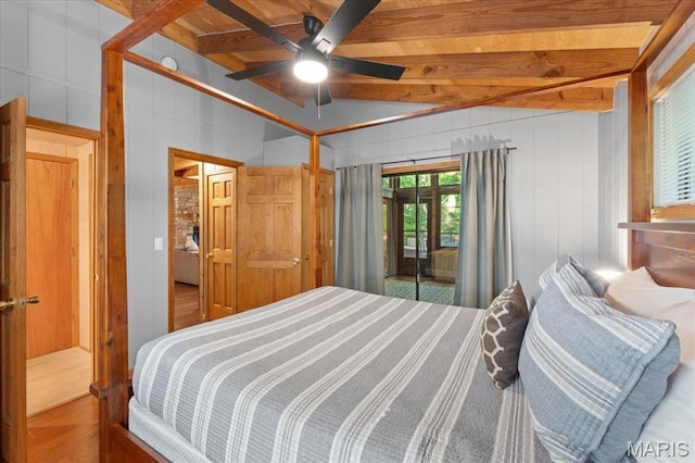 2506 Alpine Woods Dr, Wright City, MO 63390 - bedroom featuring beam ceiling, access to outside, wood finished floors, ceiling fan, and a decorative wall