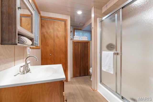 2506 Alpine Woods Dr, Wright City, MO 63390 - bathroom with wood finished floors, a shower stall, vanity, and recessed lighting