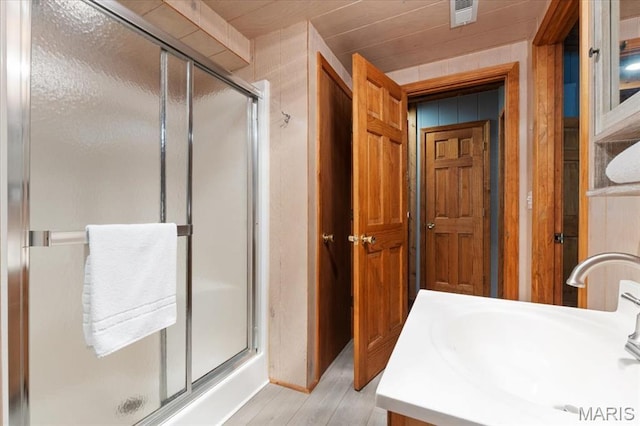 2506 Alpine Woods Dr, Wright City, MO 63390 - bathroom with a shower stall, wood finished floors, and vanity