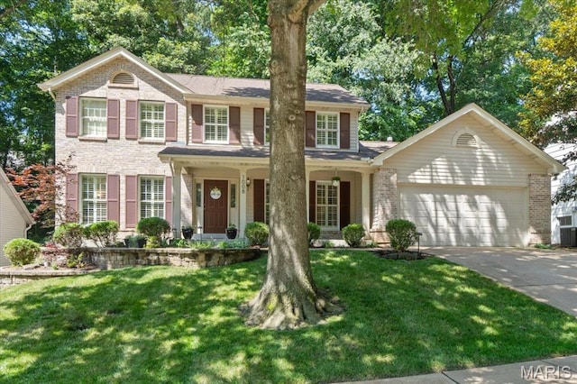 1008 Westrun Dr, Ballwin, MO 63021 - view of front of house featuring brick siding, a garage, concrete driveway, a front lawn, and covered porch