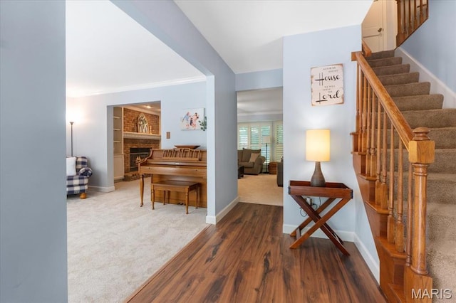 1008 Westrun Dr, Ballwin, MO 63021 - corridor with wood finished floors, stairway, and carpet