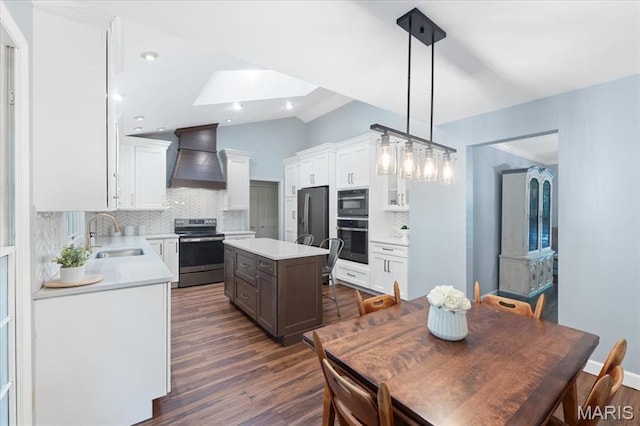 1008 Westrun Dr, Ballwin, MO 63021 - kitchen with appliances with stainless steel finishes, custom range hood, tasteful backsplash, light countertops, and vaulted ceiling