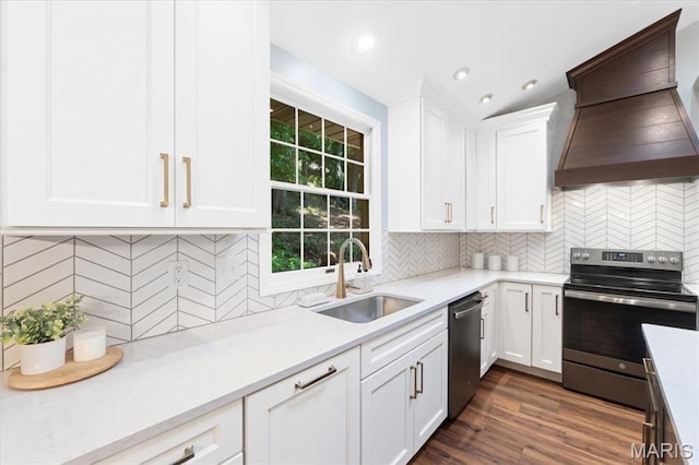 1008 Westrun Dr, Ballwin, MO 63021 - kitchen featuring appliances with stainless steel finishes, custom exhaust hood, tasteful backsplash, light countertops, and white cabinetry