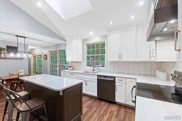 1008 Westrun Dr, Ballwin, MO 63021 - kitchen featuring appliances with stainless steel finishes, extractor fan, dark wood-type flooring, a center island, and a kitchen bar