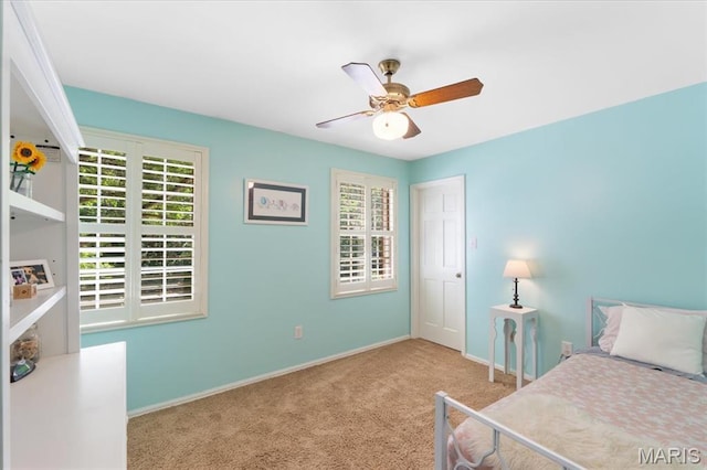 1008 Westrun Dr, Ballwin, MO 63021 - carpeted bedroom with multiple windows and ceiling fan