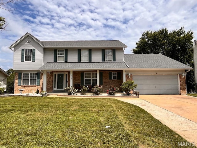 3241 Principia Ave, Saint Charles, MO 63301 - traditional-style home featuring brick siding, a garage, driveway, and a front lawn