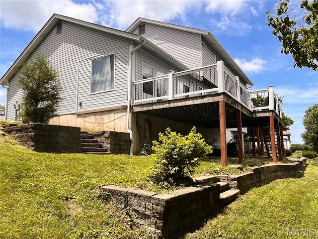 3241 Principia Ave, Saint Charles, MO 63301 - back of property with a wooden deck, a yard, and stairway