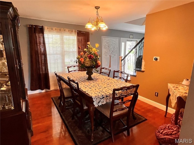 3241 Principia Ave, Saint Charles, MO 63301 - dining room featuring a chandelier and dark wood-type flooring