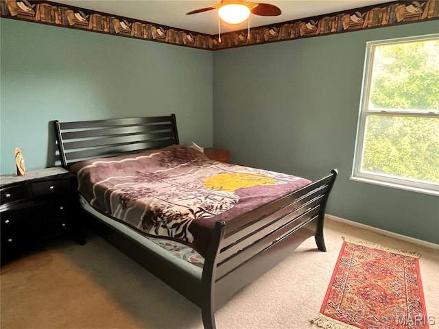 3241 Principia Ave, Saint Charles, MO 63301 - bedroom featuring carpet, multiple windows, and a ceiling fan