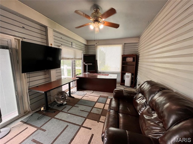 3241 Principia Ave, Saint Charles, MO 63301 - living area with a ceiling fan, a desk, and wooden walls