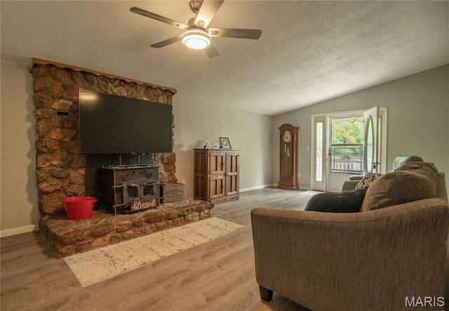 116 Buttry Ln, Wappapello, MO 63966 - living area with lofted ceiling, wood finished floors, ceiling fan, and a textured ceiling