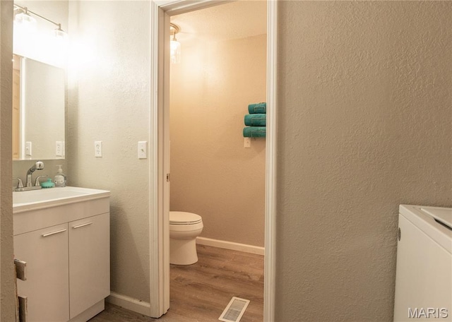 116 Buttry Ln, Wappapello, MO 63966 - bathroom with vanity, wood finished floors, and a textured wall