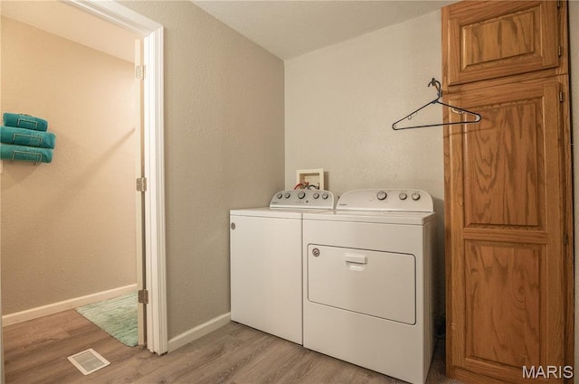 116 Buttry Ln, Wappapello, MO 63966 - laundry area featuring washer and clothes dryer and light wood-style floors