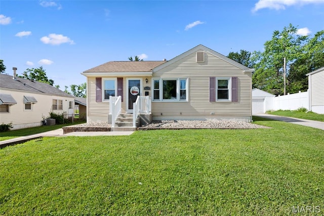 10256 Saint Dennis Ln, Saint Ann, MO 63074 - view of front facade featuring a front yard and a detached garage