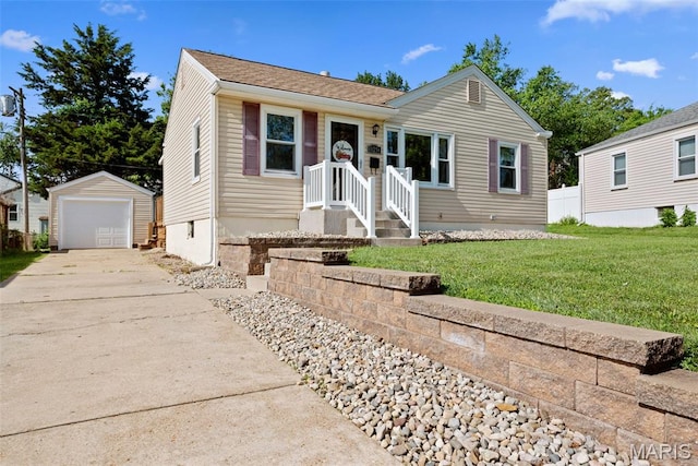 10256 Saint Dennis Ln, Saint Ann, MO 63074 - view of front of house with an outdoor structure, concrete driveway, a front yard, and a garage