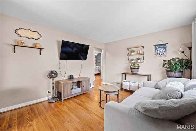 10256 Saint Dennis Ln, Saint Ann, MO 63074 - living room featuring baseboards and light wood-style flooring