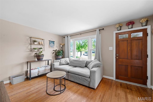 10256 Saint Dennis Ln, Saint Ann, MO 63074 - living area with light wood-style flooring and baseboards