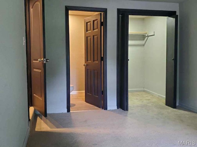 2350 Lorraine Dr E, St Louis, IL 62206 - unfurnished bedroom with a closet, carpet, a walk in closet, and connected bathroom