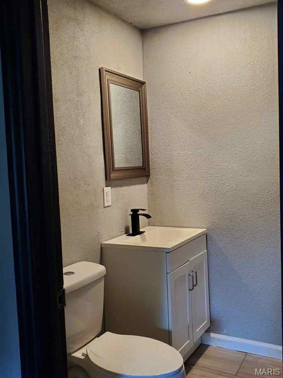 2350 Lorraine Dr E, St Louis, IL 62206 - bathroom featuring vanity and a textured wall