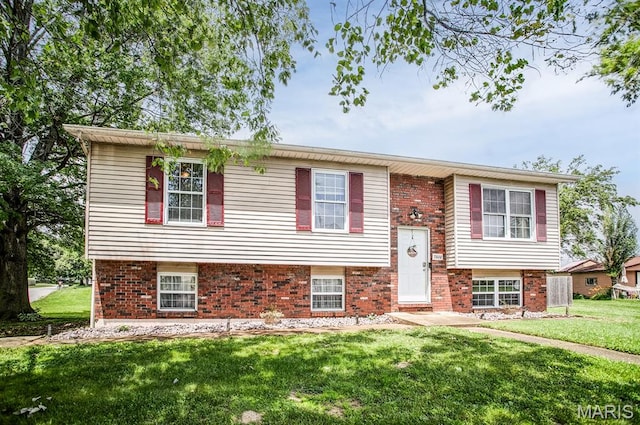 7800 Chuck Ct, Godfrey, IL 62035 - raised ranch featuring a front yard and brick siding