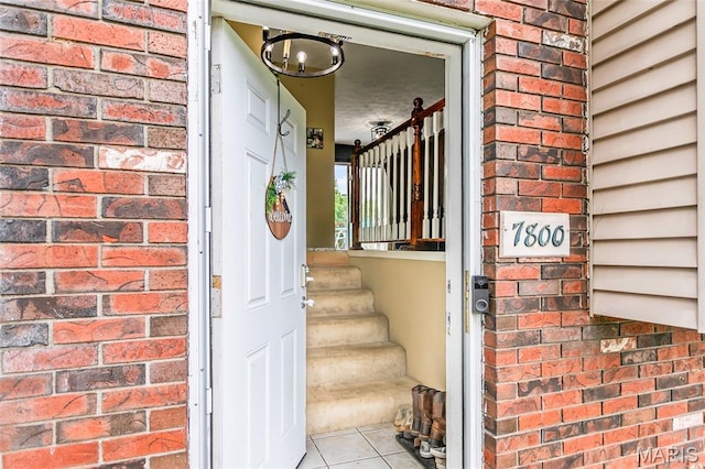 7800 Chuck Ct, Godfrey, IL 62035 - view of exterior entry featuring brick siding