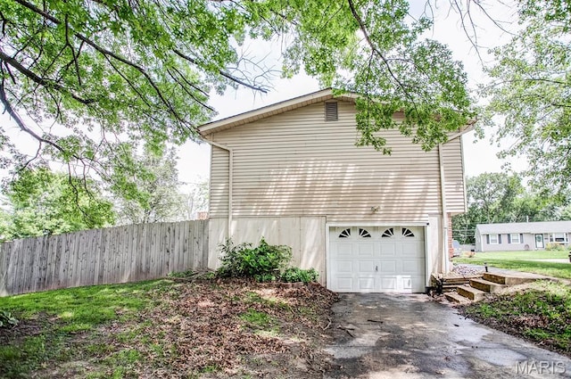 7800 Chuck Ct, Godfrey, IL 62035 - view of property exterior with driveway and a garage