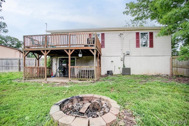 7800 Chuck Ct, Godfrey, IL 62035 - back of property featuring an outdoor fire pit, a wooden deck, a fenced backyard, and a patio area