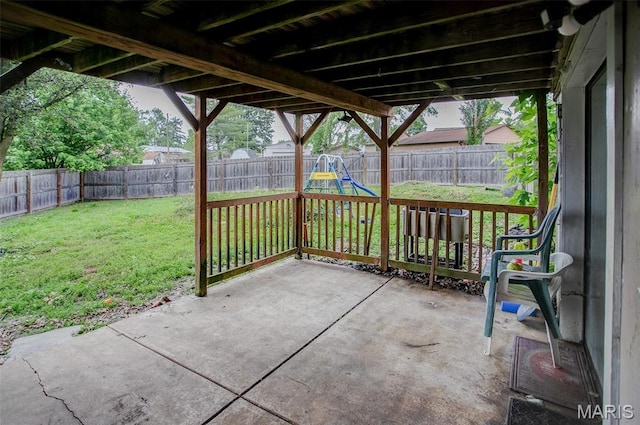 7800 Chuck Ct, Godfrey, IL 62035 - fenced backyard with a patio and a playground