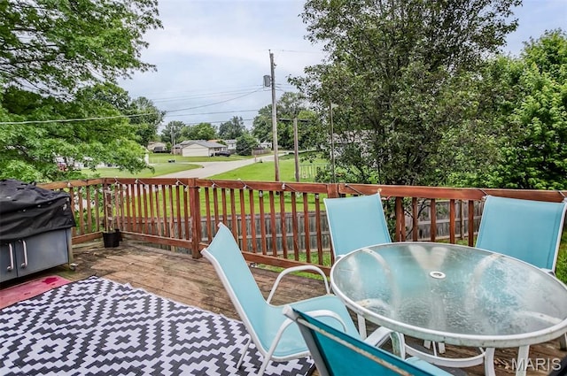 7800 Chuck Ct, Godfrey, IL 62035 - deck with outdoor dining space, a yard, and a grill