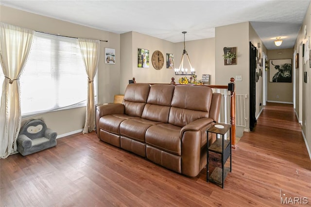7800 Chuck Ct, Godfrey, IL 62035 - living area featuring light wood finished floors and a chandelier