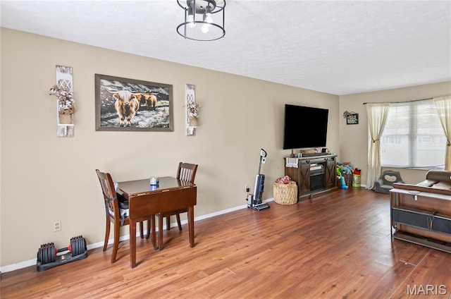 7800 Chuck Ct, Godfrey, IL 62035 - living area with wood finished floors and a textured ceiling