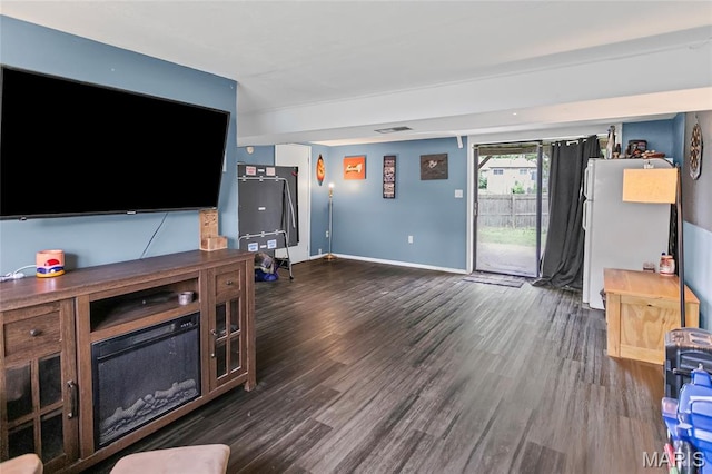 7800 Chuck Ct, Godfrey, IL 62035 - living area featuring dark wood finished floors and baseboards
