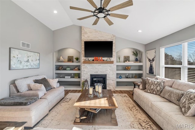 1896 W Main St, Festus, MO 63028 - living area featuring built in shelves, lofted ceiling, a ceiling fan, and wood finished floors