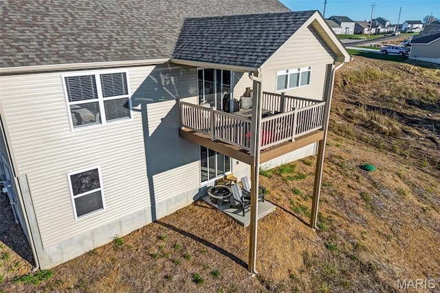 1896 W Main St, Festus, MO 63028 - back of property with a shingled roof, a wooden deck, and a patio