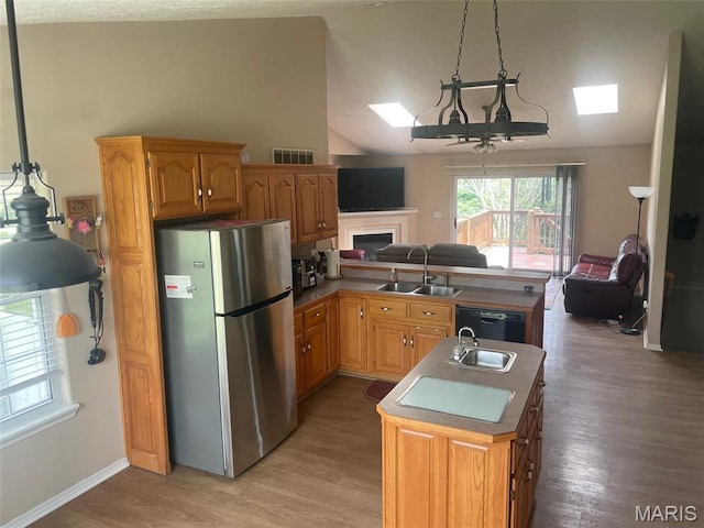 17035 Lanes End, Dixon, MO 65459 - kitchen with freestanding refrigerator, open floor plan, lofted ceiling, a skylight, and dishwasher